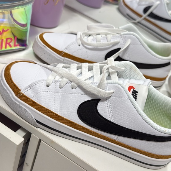 Nike Shoes - Nike White Sneakers with Black and Brown Details